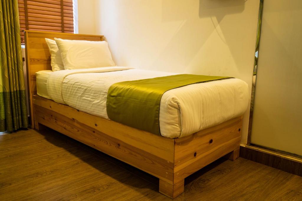 Postel nebo postele na pokoji v ubytování Hotel Ganthera Kandy