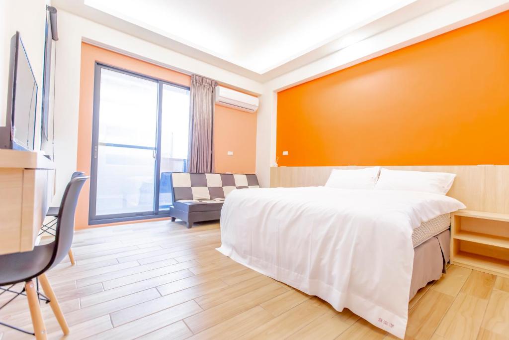 Postel nebo postele na pokoji v ubytování WOW Penghu Homestay
