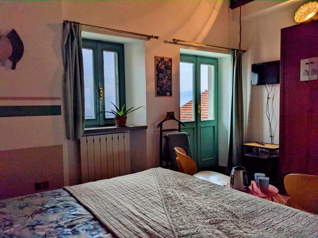 Łóżko lub łóżka w pokoju w obiekcie B&B Il Poggiolo