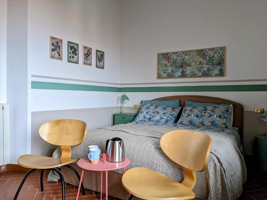 Łóżko lub łóżka w pokoju w obiekcie B&B Il Poggiolo