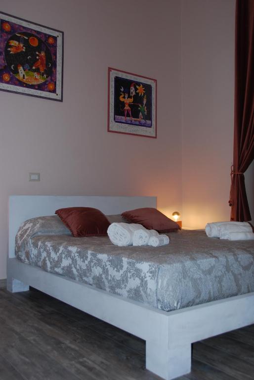 Posteľ alebo postele v izbe v ubytovaní Home Art Colosseo