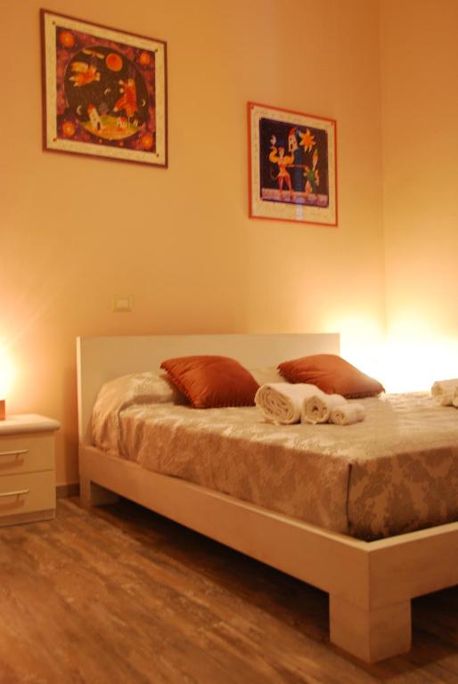 Posteľ alebo postele v izbe v ubytovaní Home Art Colosseo