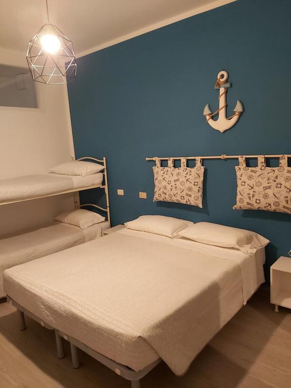 Postel nebo postele na pokoji v ubytování Hotel 21 Riccione