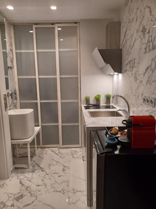 Kuchyň nebo kuchyňský kout v ubytování Sroom Apartment