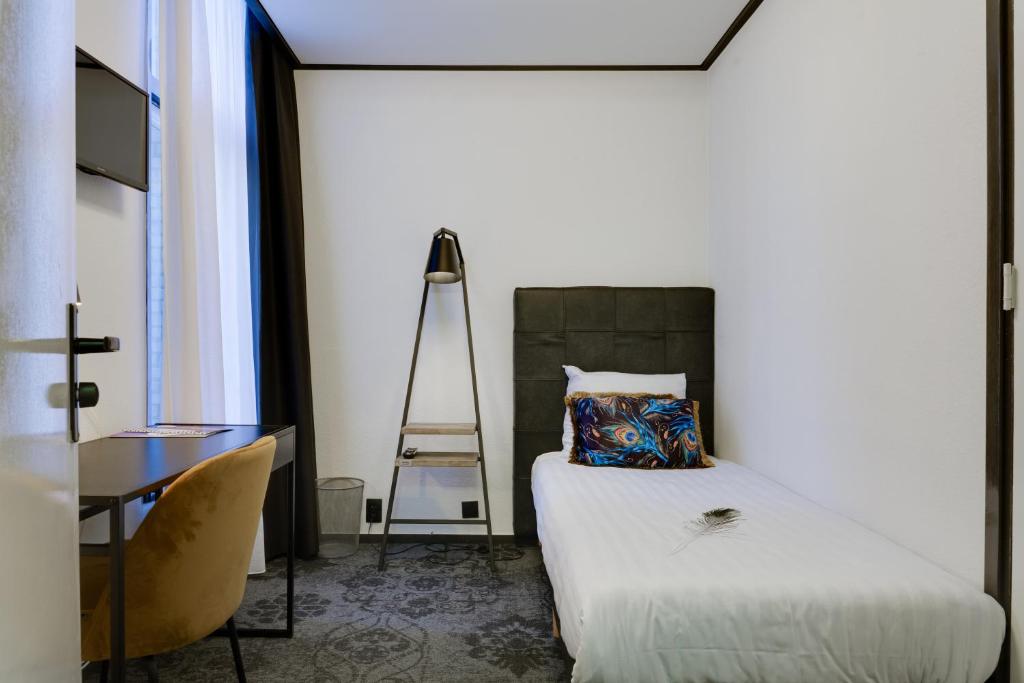 Postel nebo postele na pokoji v ubytování Hotel Pauw