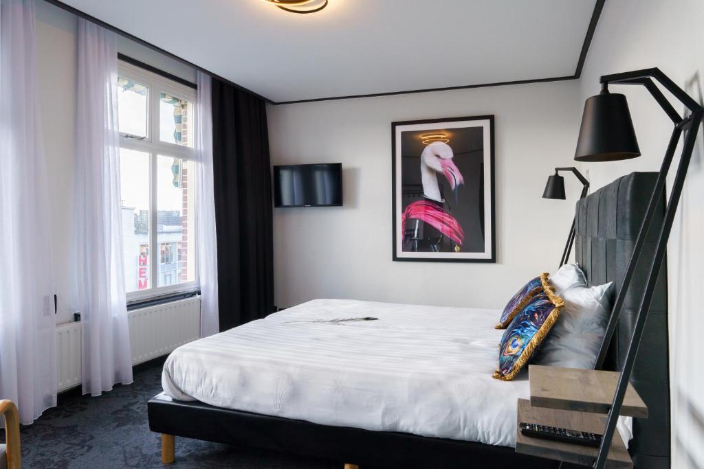 Postel nebo postele na pokoji v ubytování Hotel Pauw