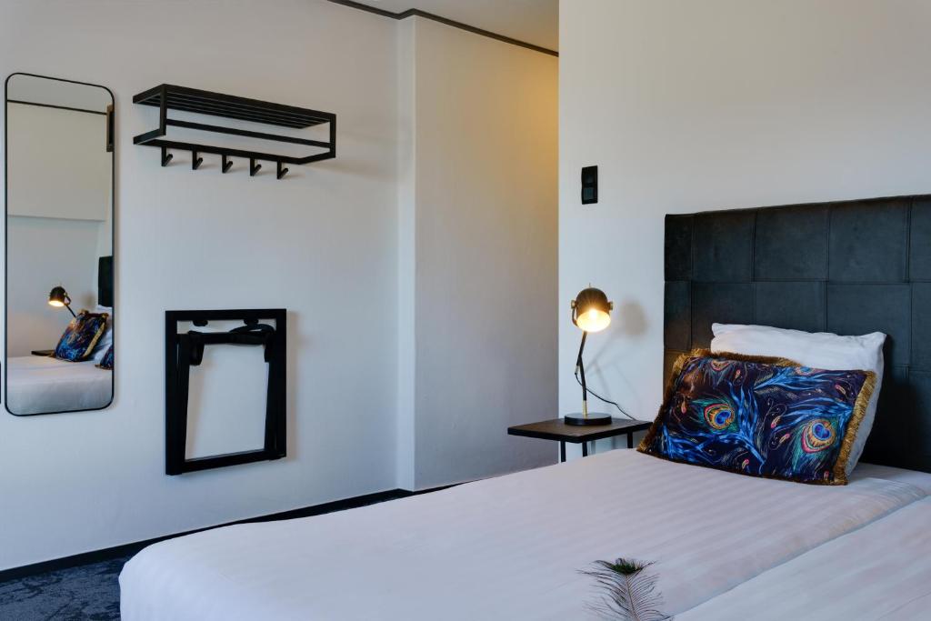 Postel nebo postele na pokoji v ubytování Hotel Pauw