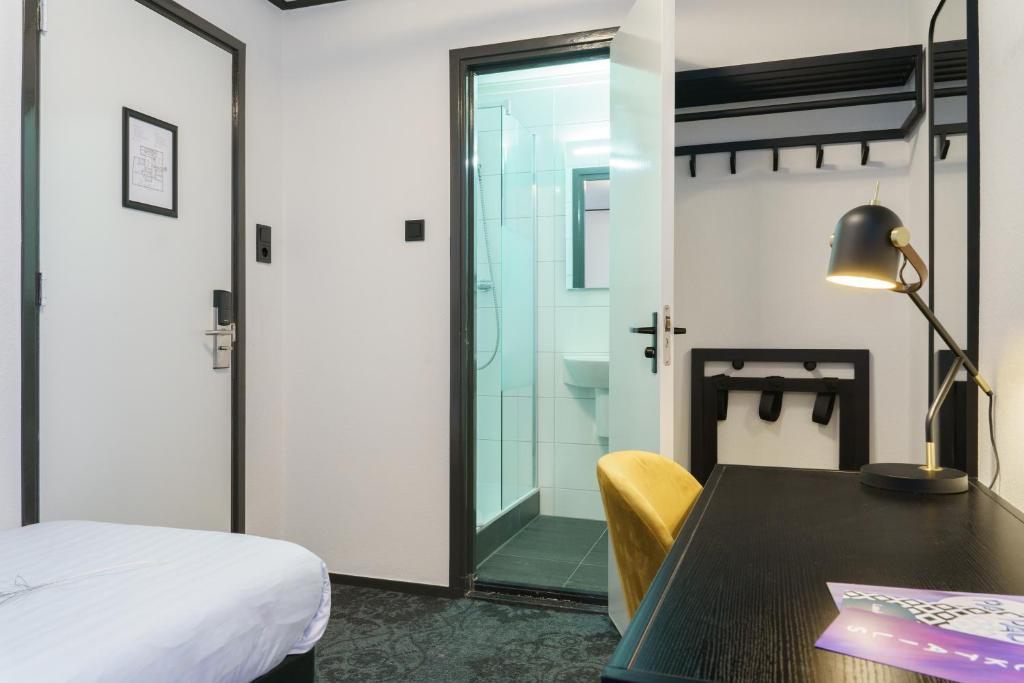 Postel nebo postele na pokoji v ubytování Hotel Pauw