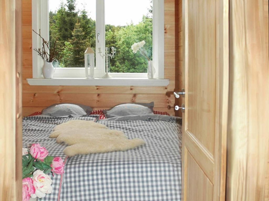 Postel nebo postele na pokoji v ubytování Wooden house with sauna in Küstelberg