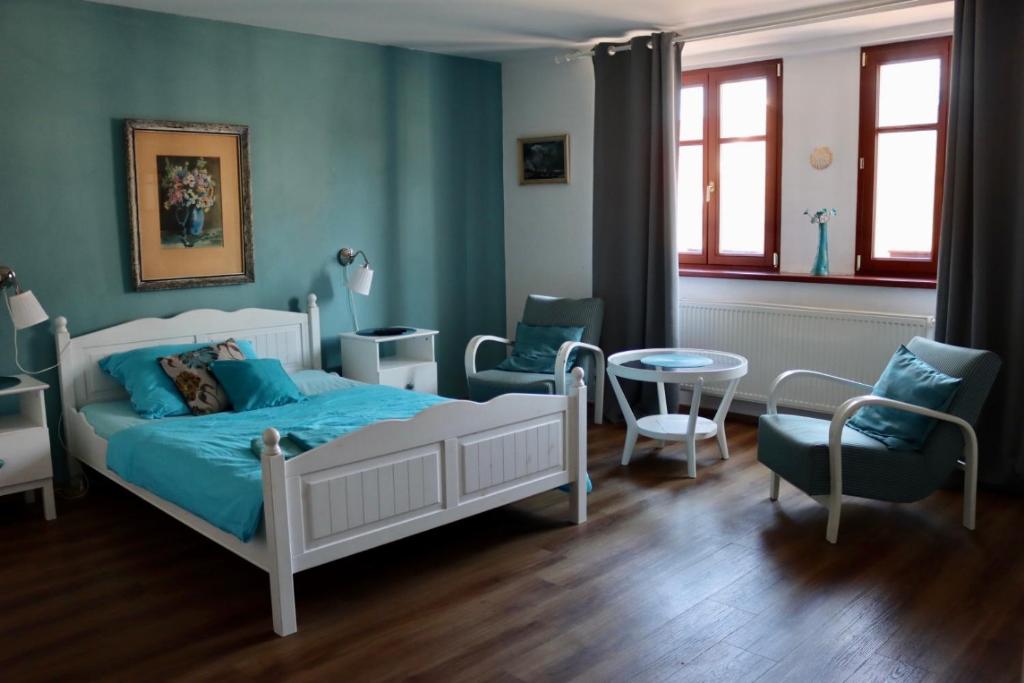 Postel nebo postele na pokoji v ubytování Penzion U Kapra