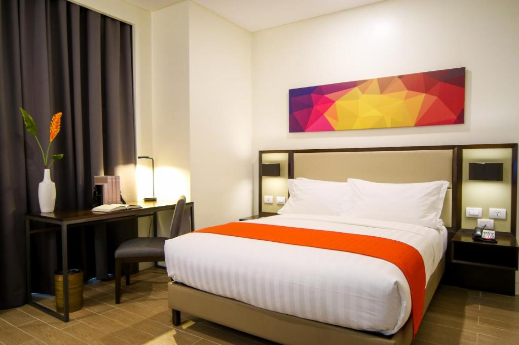 Postel nebo postele na pokoji v ubytování Hotel Lucky Chinatown Binondo