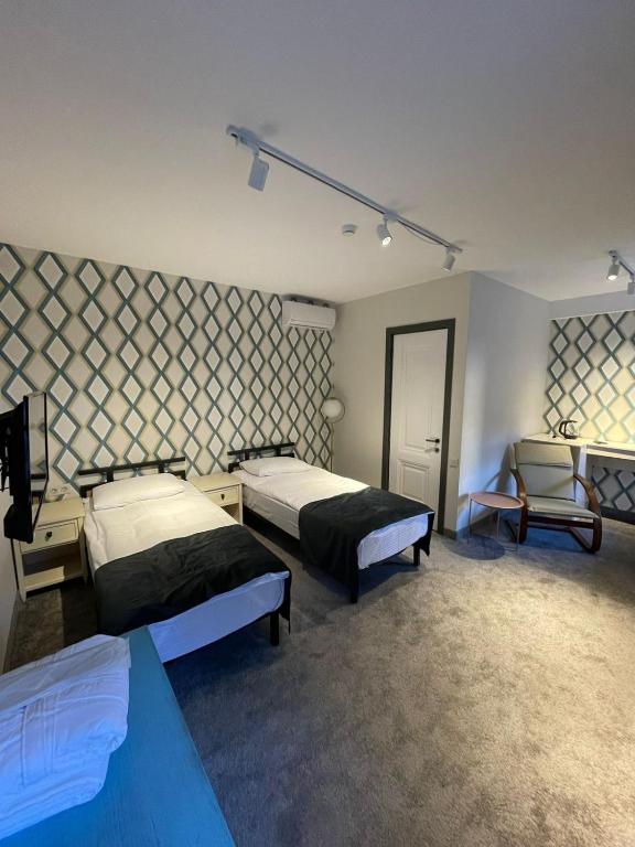 Postel nebo postele na pokoji v ubytování Betlemi Hotel