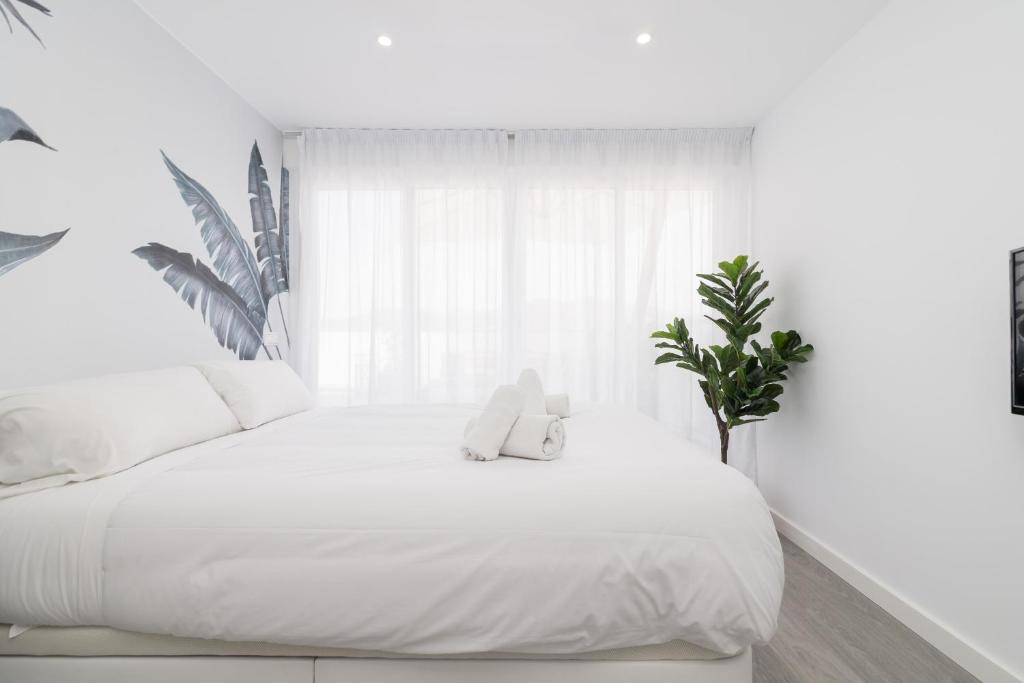 Posteľ alebo postele v izbe v ubytovaní Suite Homes Penthouse Capuchinos