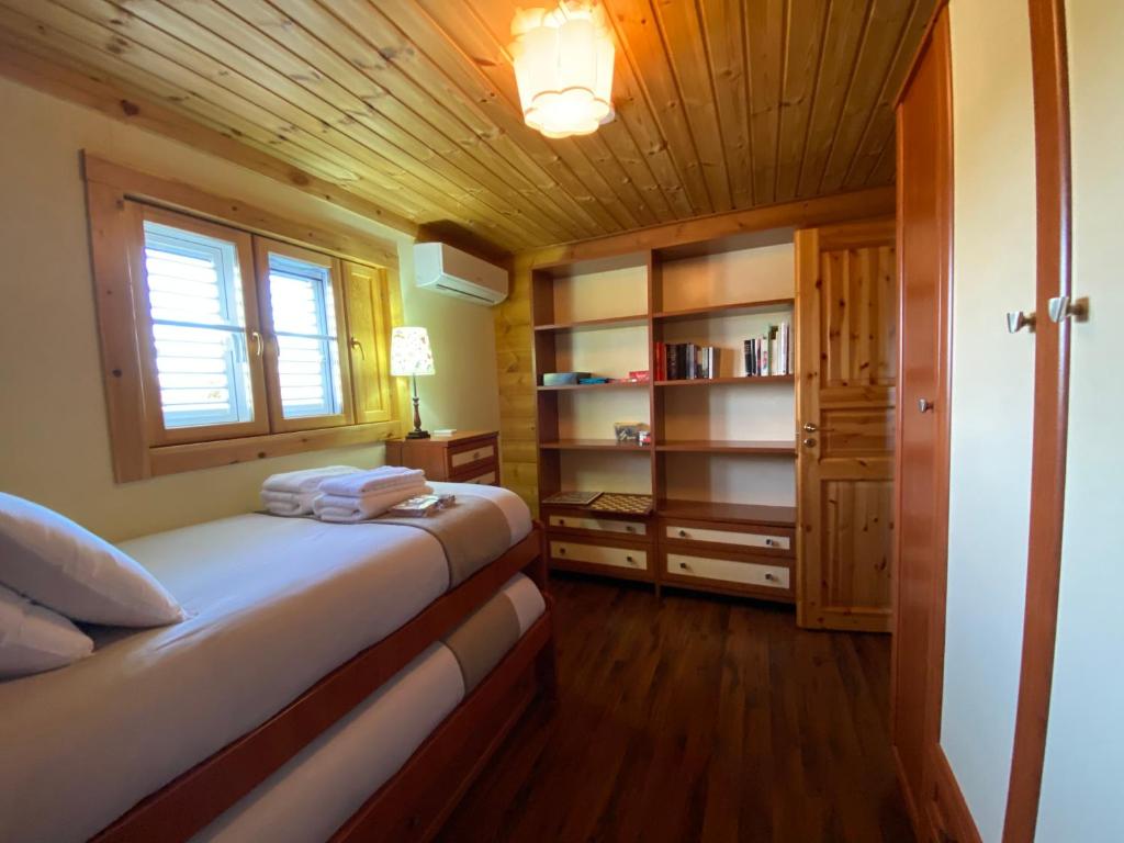 Postel nebo postele na pokoji v ubytování VILLA LUISA