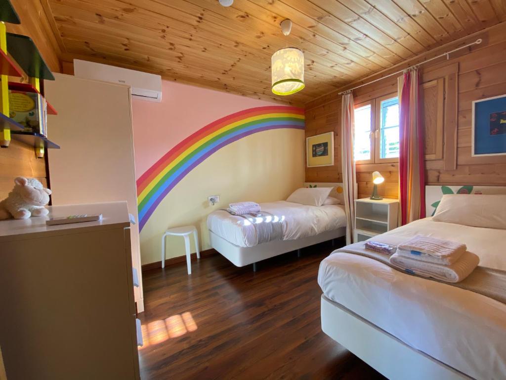 Postel nebo postele na pokoji v ubytování VILLA LUISA