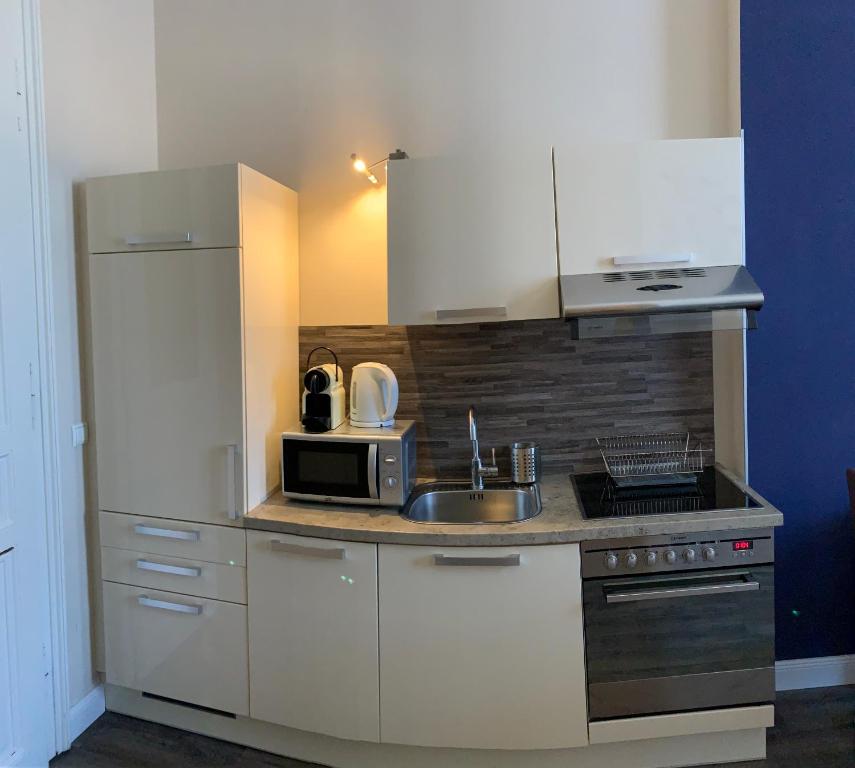 Kuchyňa alebo kuchynka v ubytovaní KH Apartments Universitaet