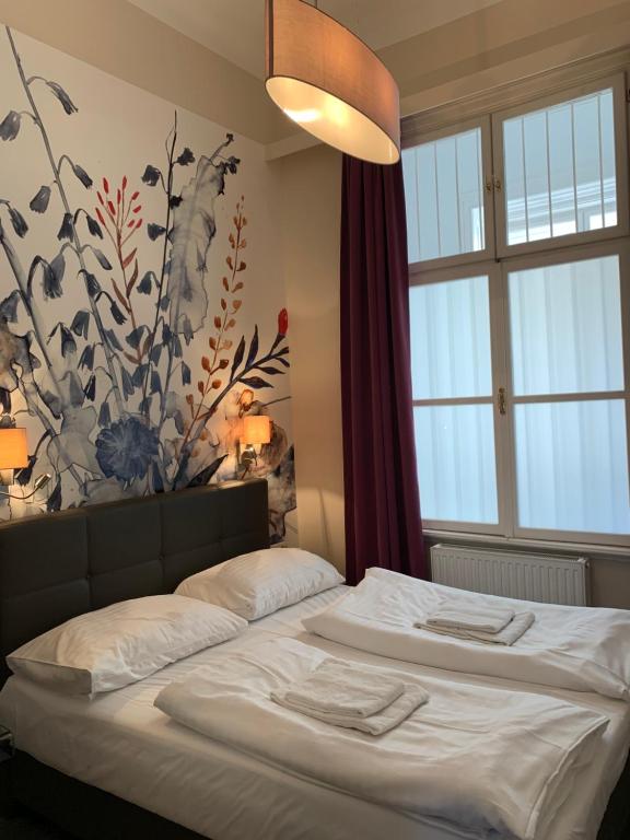 Posteľ alebo postele v izbe v ubytovaní KH Apartments Universitaet