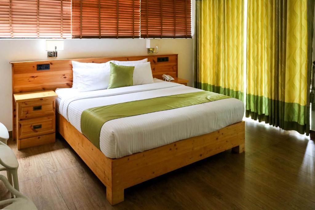 Postel nebo postele na pokoji v ubytování Hotel Ganthera Kandy