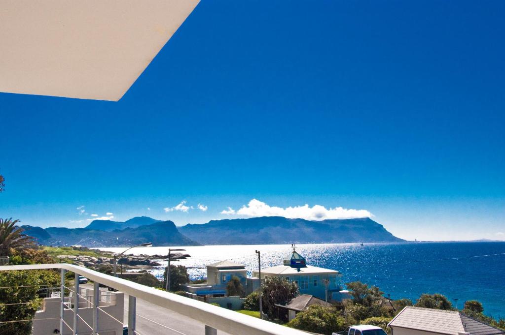 a view of the ocean from the balcony of a house at Sail Away Studios in Simonʼs Town