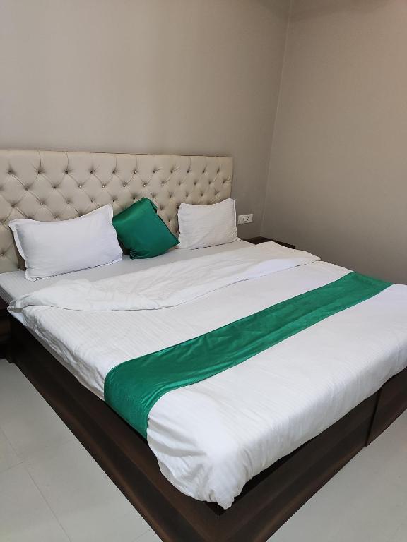 Postel nebo postele na pokoji v ubytování Hotel Green Apple