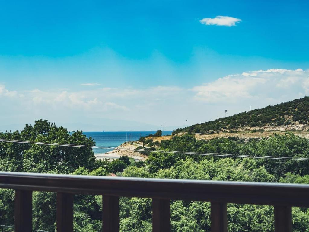 a view of the ocean from a balcony at Ena-Lia Studios in Skala Marion