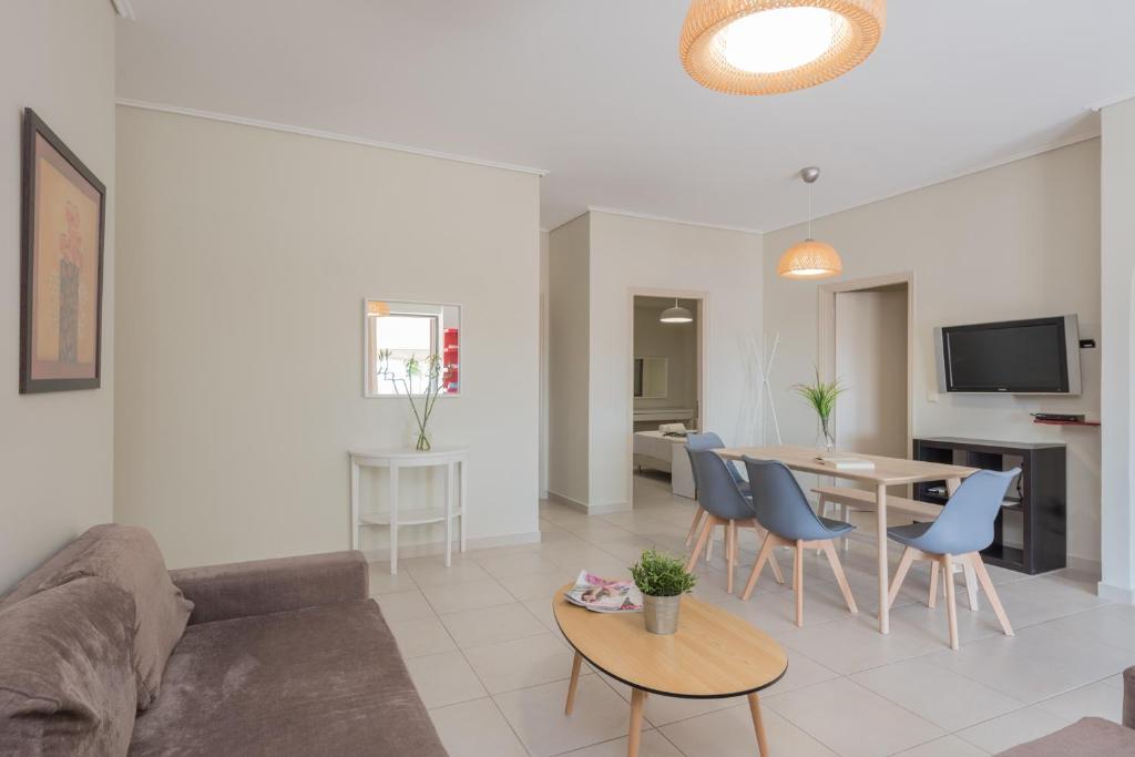 Televízia a/alebo spoločenská miestnosť v ubytovaní Phoenix Apartments