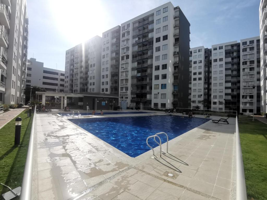a large swimming pool in front of some buildings at Hermoso Apartamento Zona Norte Miramar # in Barranquilla