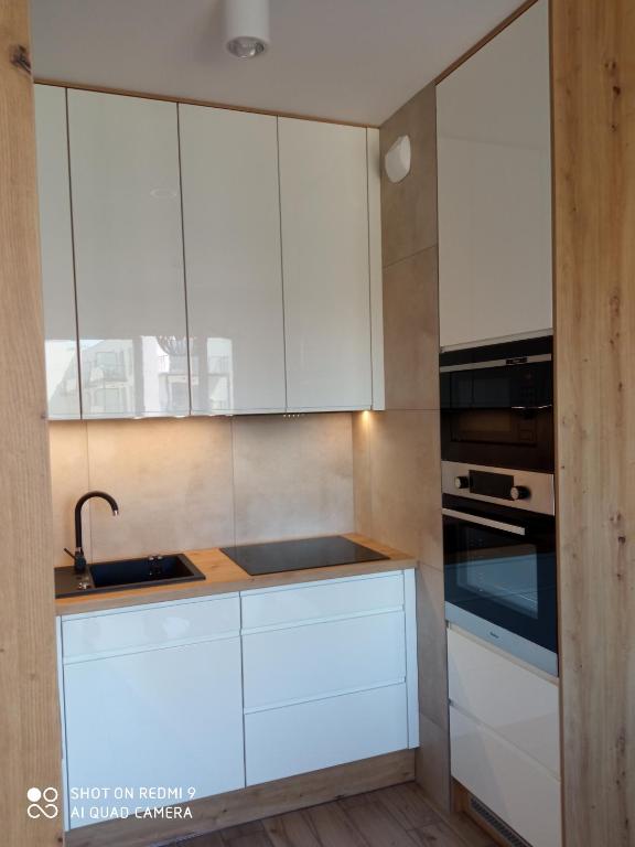 Kuchyňa alebo kuchynka v ubytovaní Nadmorski Apartament Dream w Gdańsku