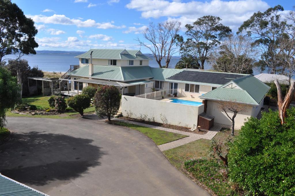 an aerial view of a house with a swimming pool at Bambra Reef Lodge in Sandford