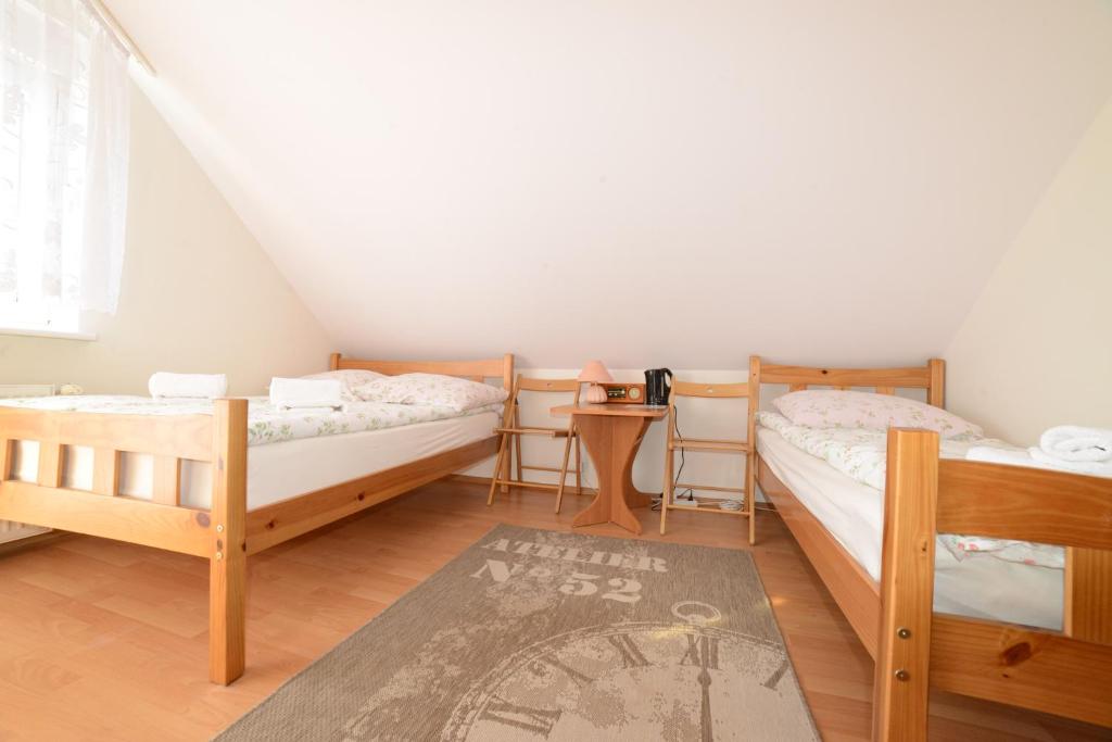 Postel nebo postele na pokoji v ubytování Dom Gościnny Piotr
