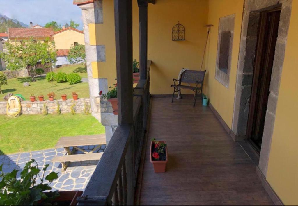 a porch of a house with a bench on it at Gran Pedroso de Llanes in Llanes