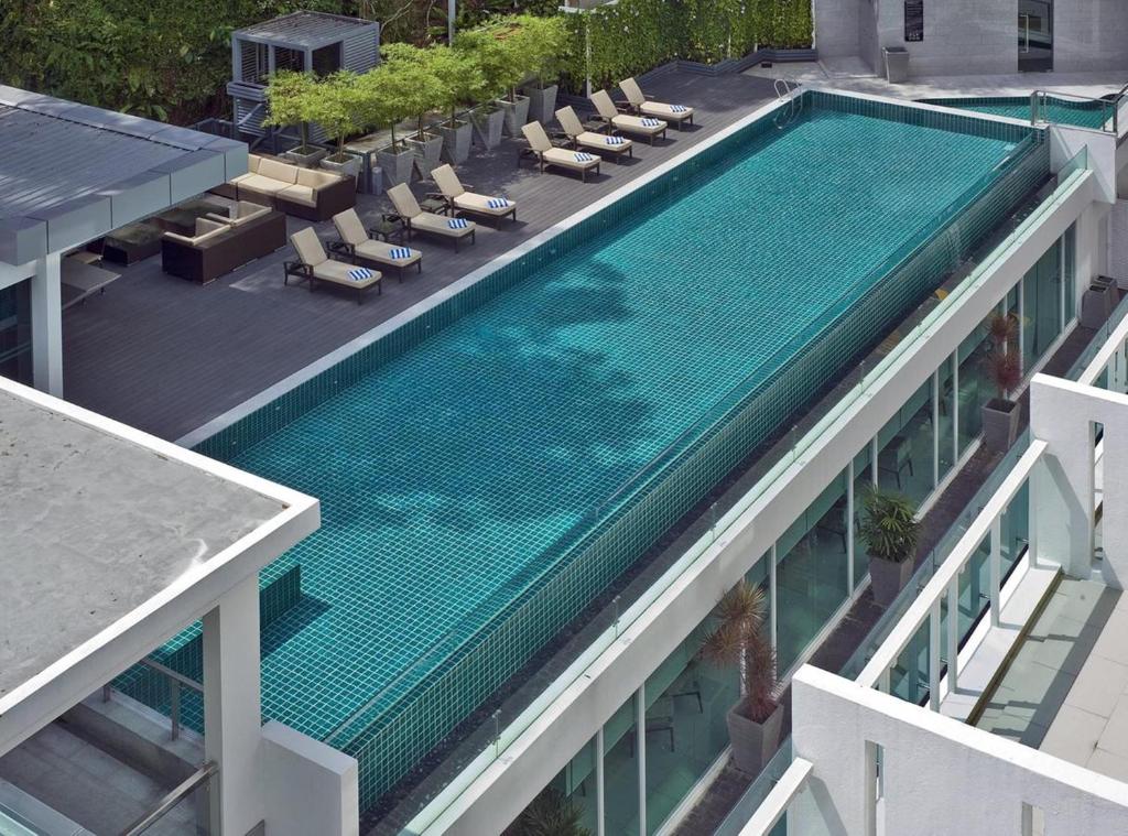 an overhead view of a swimming pool on top of a building at Damas Suites & Residences Kuala Lumpur in Kuala Lumpur