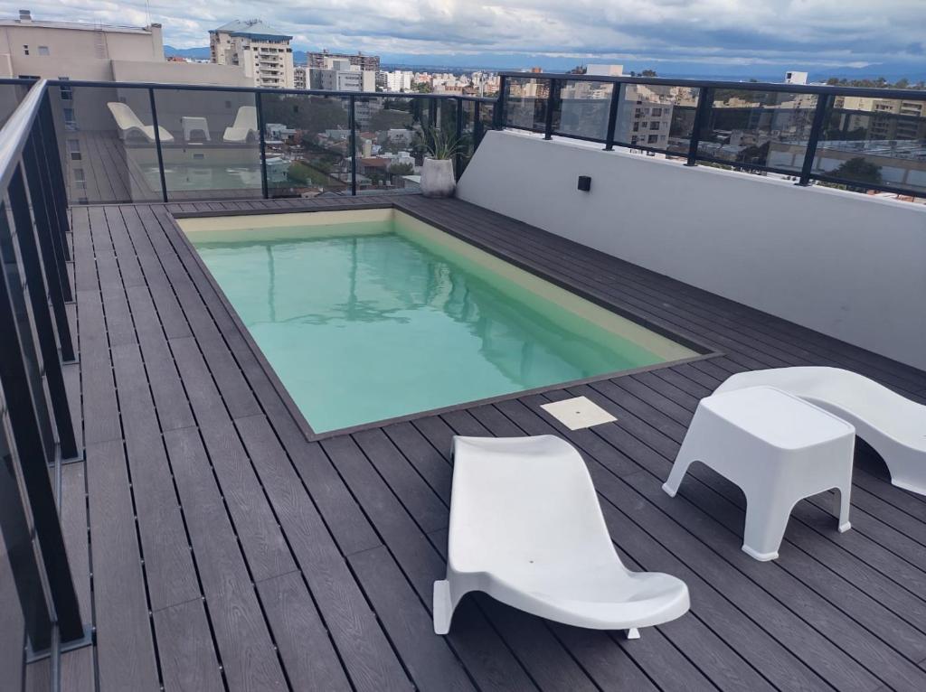 a swimming pool on the roof of a building at DEPARTAMENTO AZ SUITE in Salta