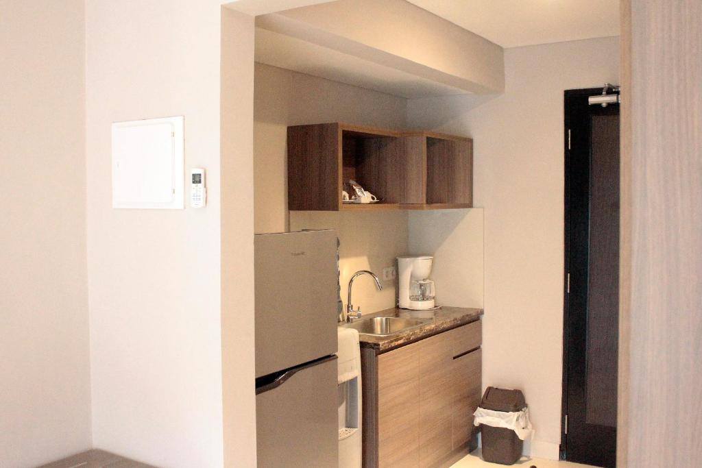 Kuchyň nebo kuchyňský kout v ubytování Mambruk Hotel & Convention