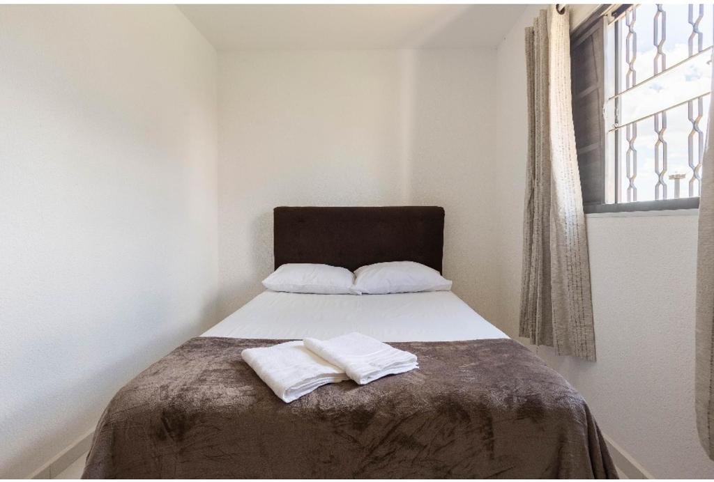 Posteľ alebo postele v izbe v ubytovaní D01 Apto com estacionamento, piscina e churrasqueira