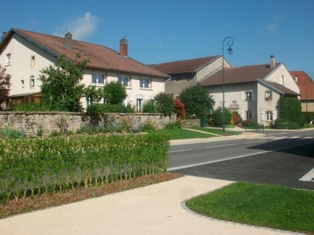 a house on a street with a road and buildings at Gîte Repaix, 5 pièces, 8 personnes - FR-1-584-45 