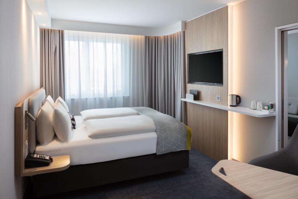 Postel nebo postele na pokoji v ubytování Holiday Inn Express - Aarburg - Oftringen by IHG