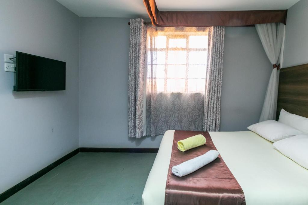 Postel nebo postele na pokoji v ubytování Kings Premier Inn