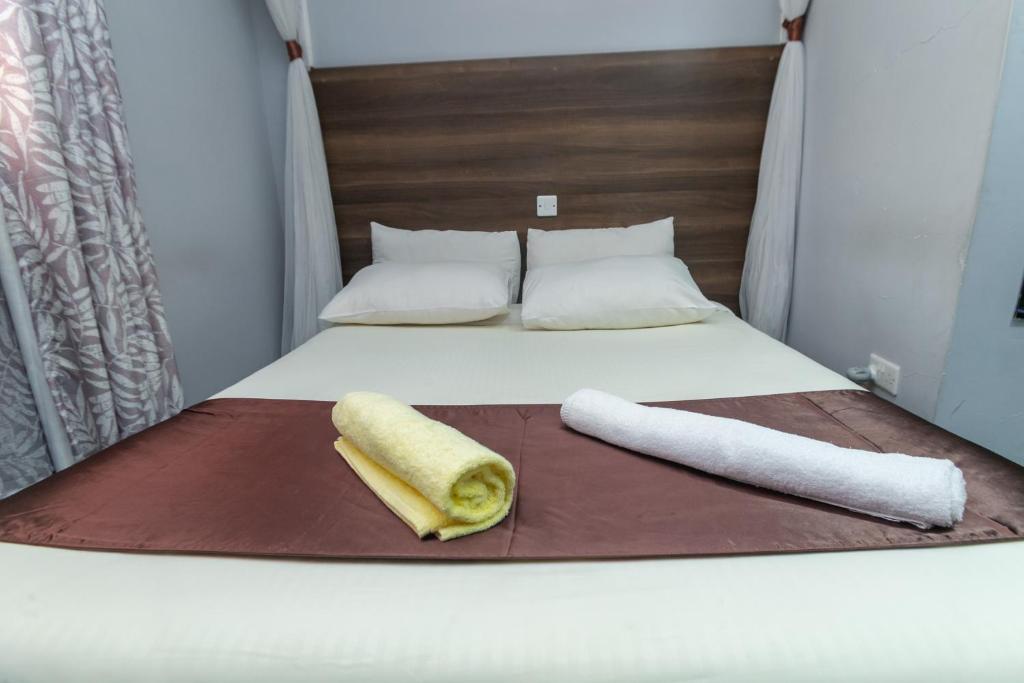 Postel nebo postele na pokoji v ubytování Kings Premier Inn