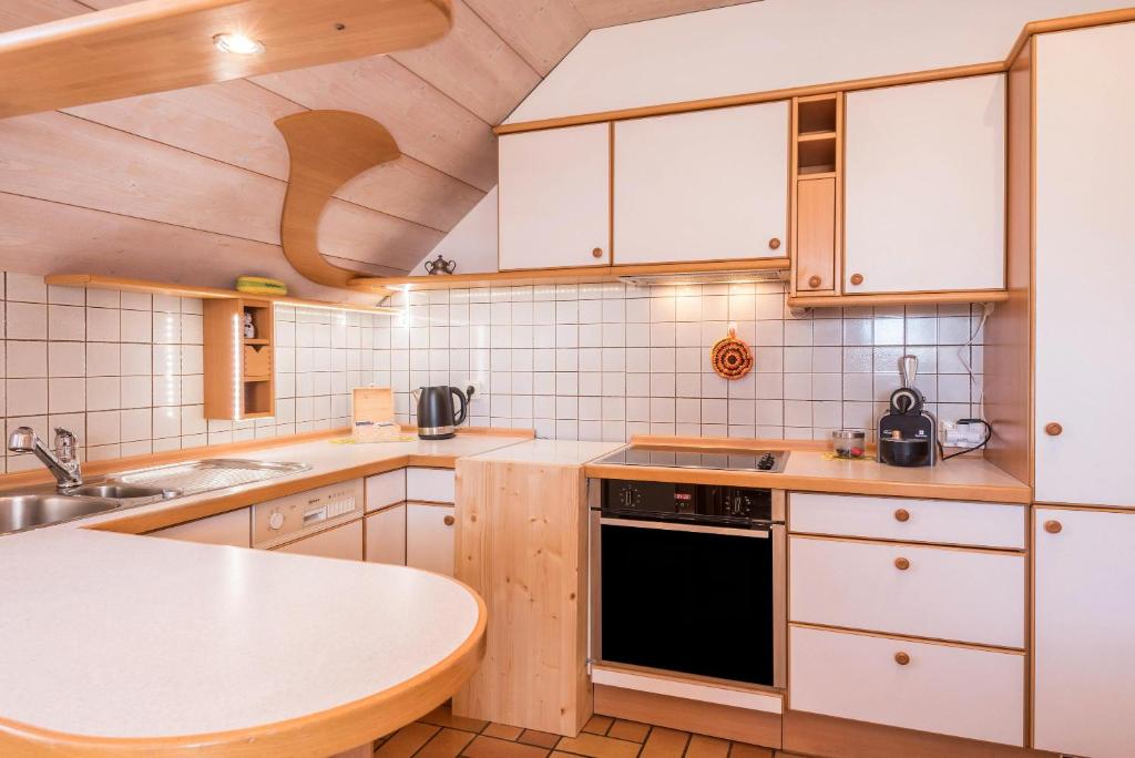 Kuchyň nebo kuchyňský kout v ubytování Apartment Vigl Lodge