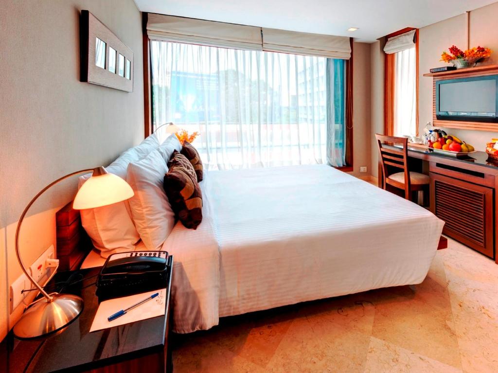 Postel nebo postele na pokoji v ubytování Hotel Casa Fortuna