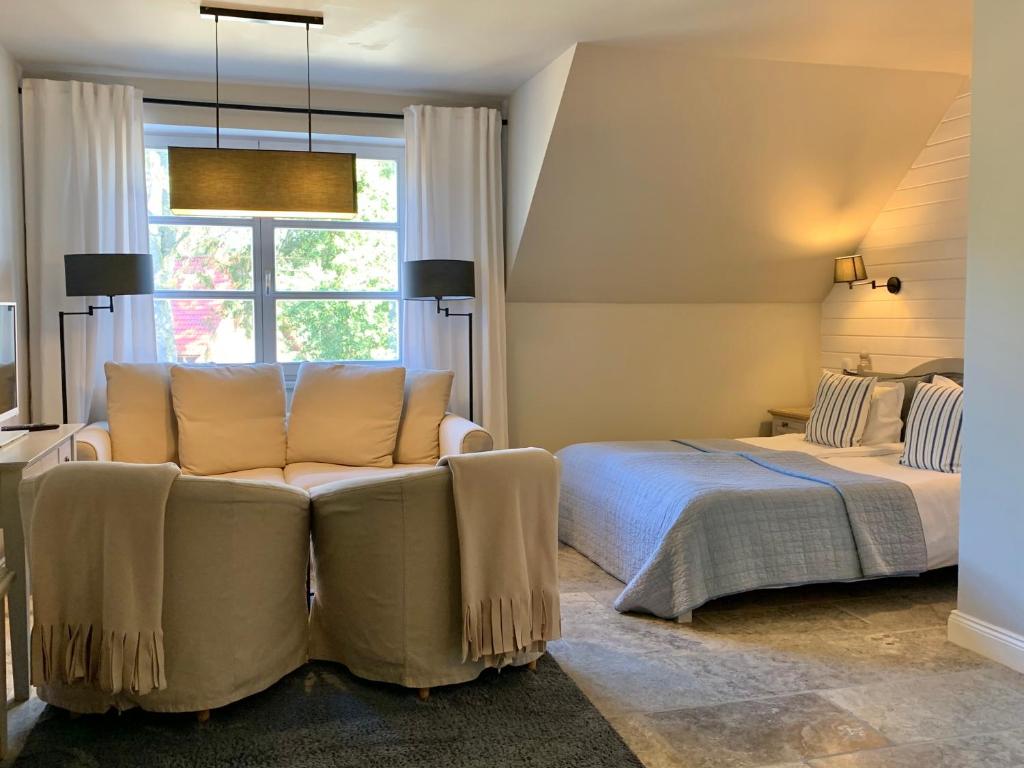 Postel nebo postele na pokoji v ubytování Villa Park Wisełka Spa & Wellness