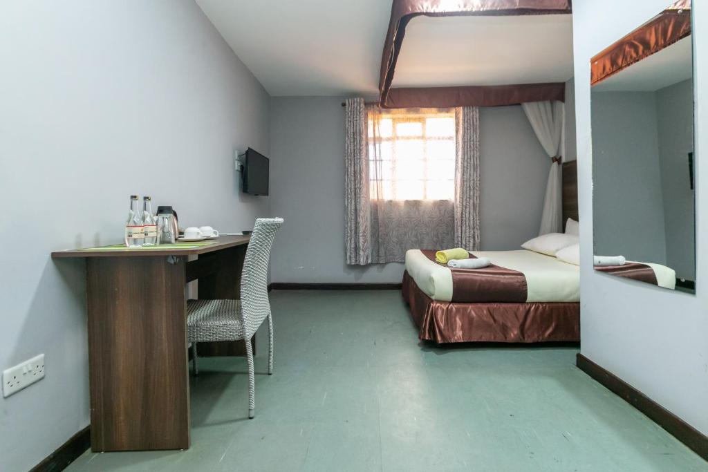 Postel nebo postele na pokoji v ubytování Kings Premier Inn