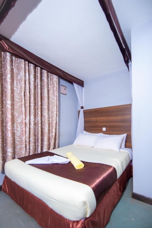 Postel nebo postele na pokoji v ubytování Kings Premier Inn