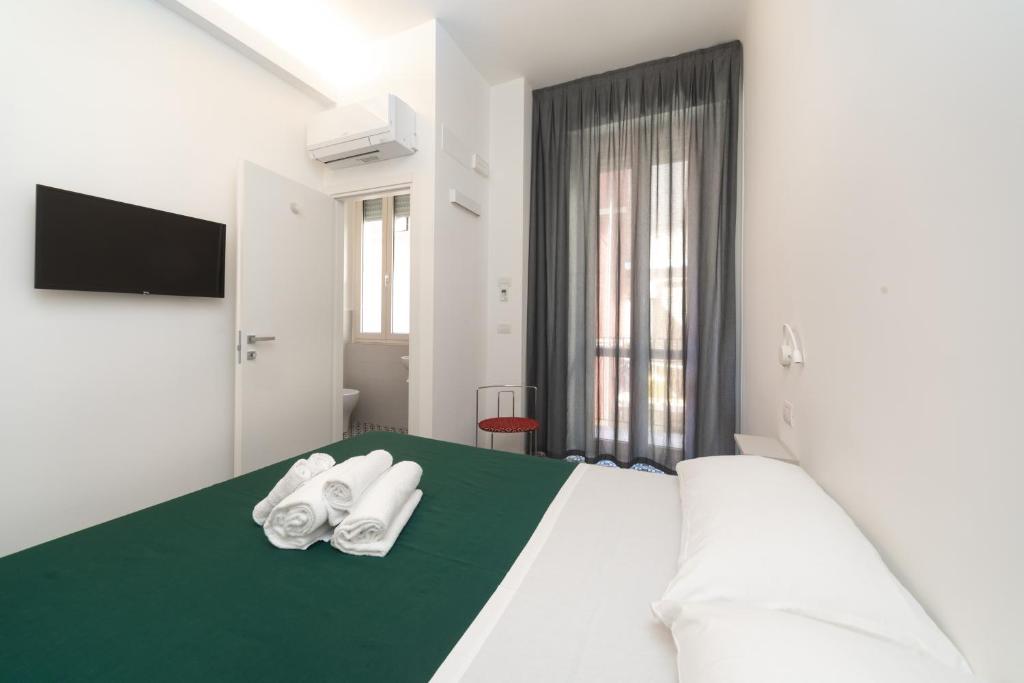 Postel nebo postele na pokoji v ubytování Seven Rooms