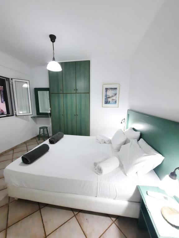 Posteľ alebo postele v izbe v ubytovaní Panorama Apartments Fiscardo