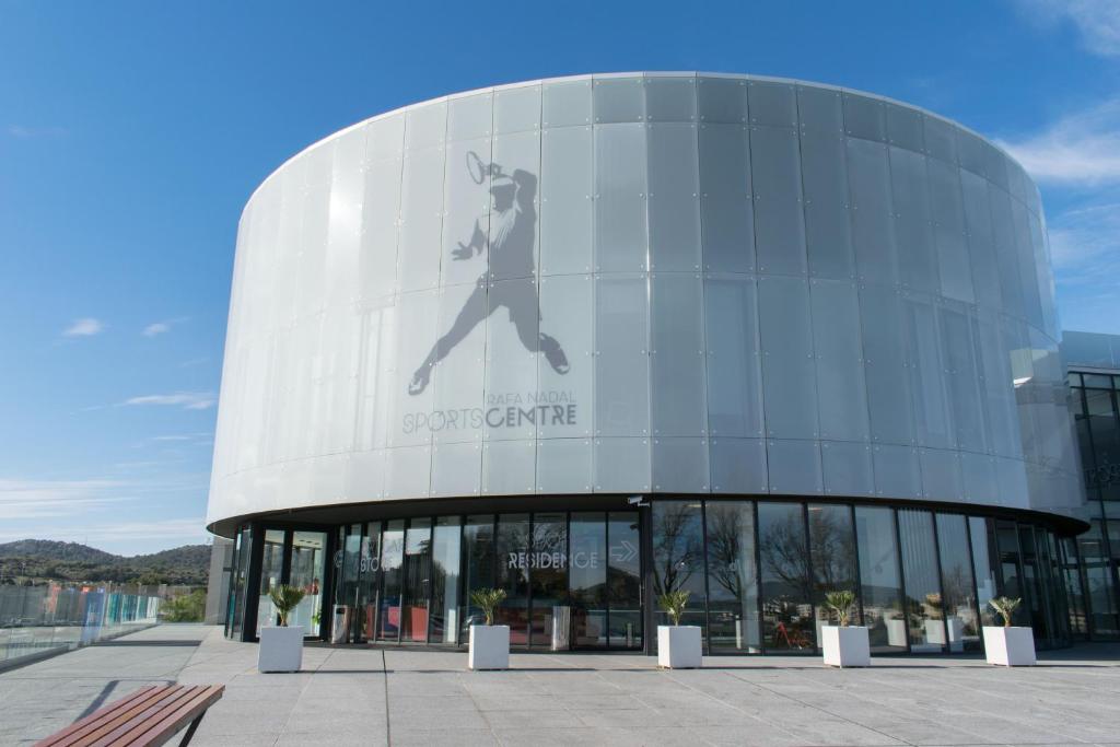 a building with a picture of a man on the side of it at Rafa Nadal Residence in Manacor