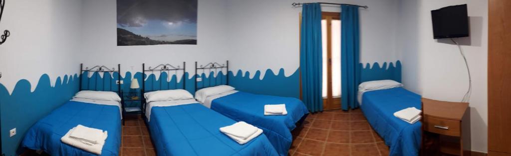 Casa Rural ENTRESIERRAS - Sala De Cuádruple Premium