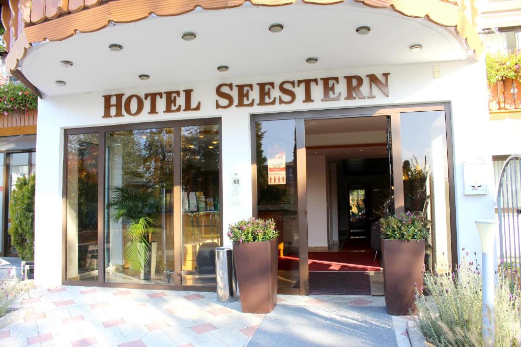 a hotel exterior with a sign that reads hotel session at Hotel Seestern in Wasserburg am Bodensee