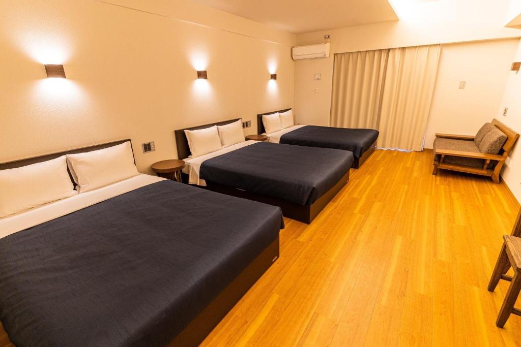 Postel nebo postele na pokoji v ubytování Hotel Iori